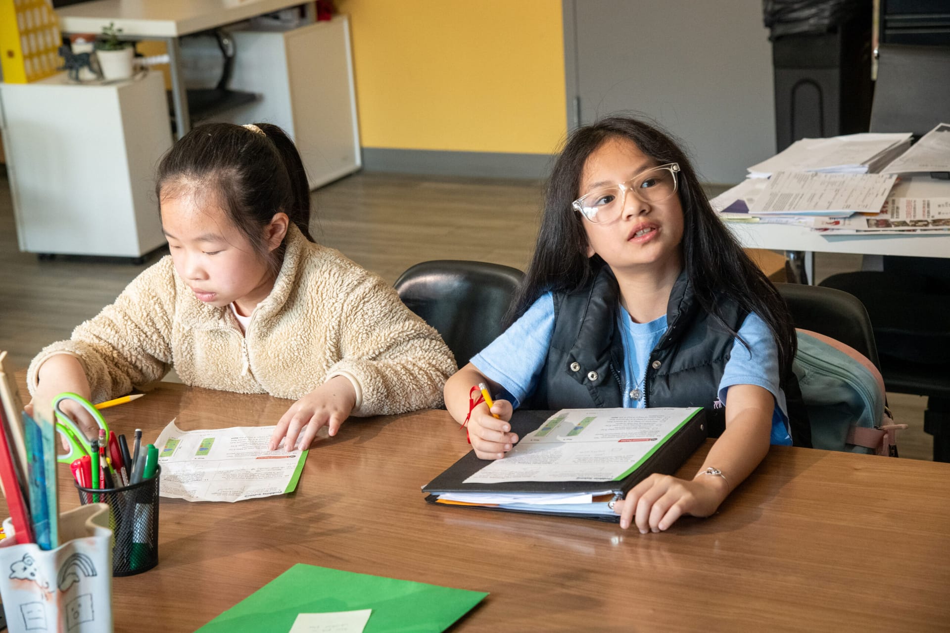 School-age Asian students doing homework.